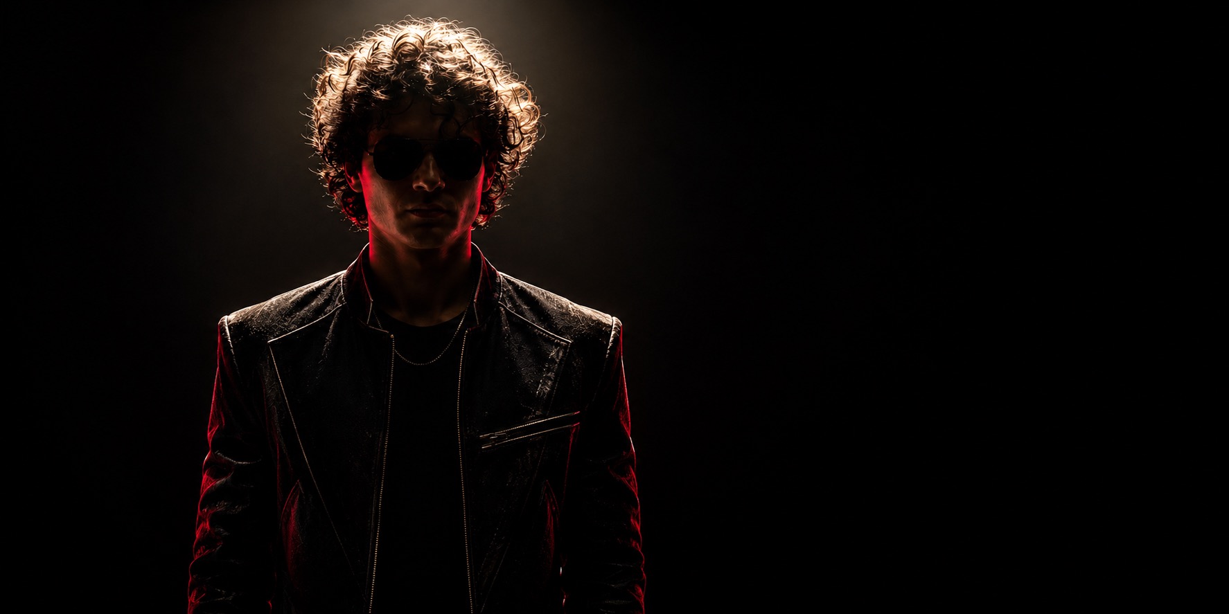 Daniel Valeur under dramatic red stage light